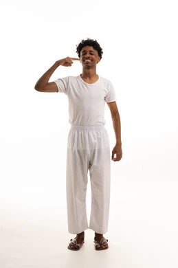 Saudi Man in White Undergarments Pointing to Smile