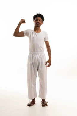 Saudi Man Flexing Muscle in Traditional White Underwear