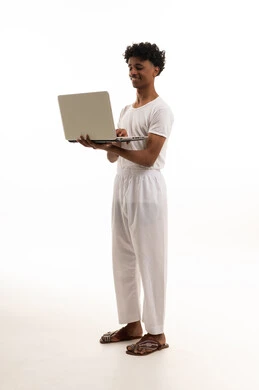 Saudi Man Using Laptop in White Traditional Clothes