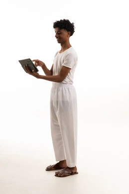 Saudi Young Man Using Tablet in White Underclothing