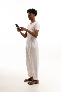 Saudi Man Using Smartphone in White Inner Clothing