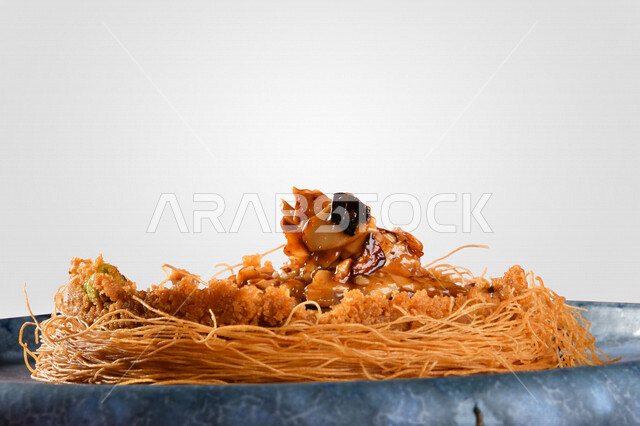 A delicious piece of chocolate stuffed poppy sweets, sweets and sugars, delicious candy pieces, colorful background, tahlia, oriental sweets, Ramadan sweets, cold and delicious sweets