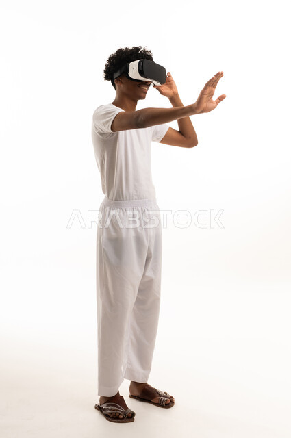 Saudi Man Using VR Headset on White Background