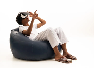 Saudi Man Using VR Headset on Bean Bag