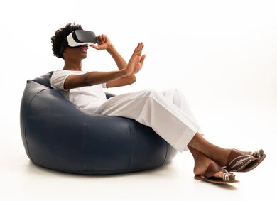 Saudi Man Using VR Headset on Bean Bag Chair
