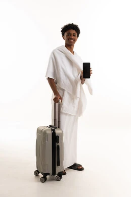 Saudi Man in Ihram with Suitcase and Smartphone