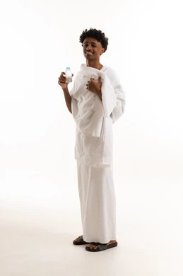 Saudi Man in Ihram Holding Water Bottle Studio
