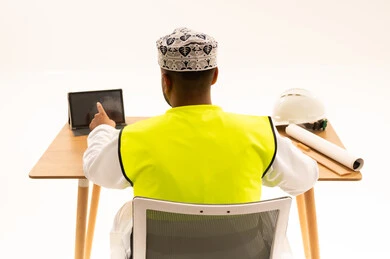 Omani Engineer with Tablet and Safety Vest