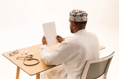 Omani Doctor at Office Desk with Stethoscope