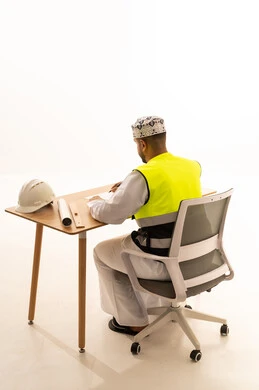 Omani Engineer in Traditional Dress with Safety Gear