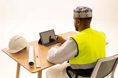 Omani Engineer with Safety Vest and Tablet