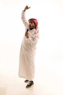 Saudi Man Singing into Microphone in Studio