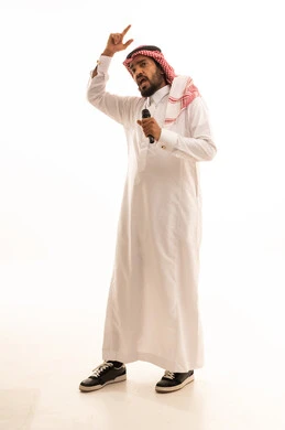 Saudi Man in Traditional Thobe Speaking with Microphone