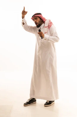 Saudi Man in Traditional Thobe Holding Microphone