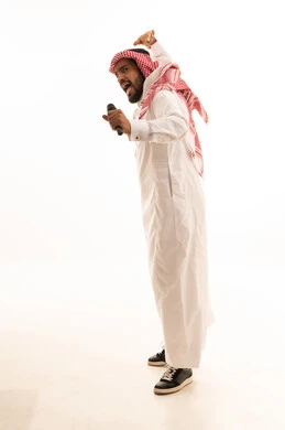 Saudi Man Performing with Microphone on White Background