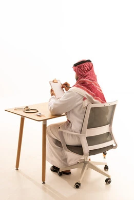 Saudi Male Professional Writing on Clipboard in Office Studio