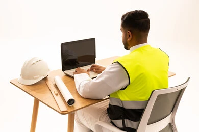 Saudi Engineer with Laptop and Safety Vest