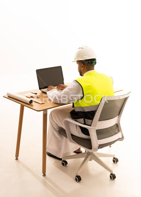 Arab Engineer in Safety Vest Working on Laptop