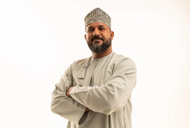 Omani Man in Traditional Dishdasha and Kumma