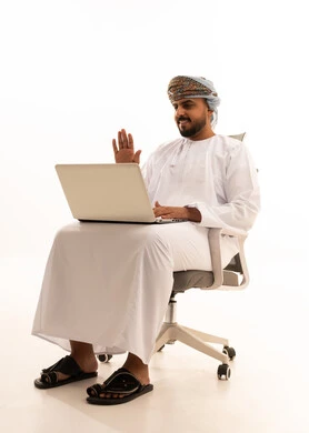 Omani Businessman on Laptop Video Call White Background