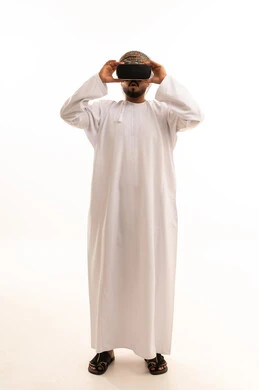 Omani Man in Traditional Dress Using VR Headset