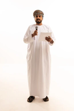 Omani Man with Microphone and Paper in Studio