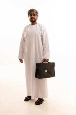 Omani Businessman in Traditional Dress with Briefcase