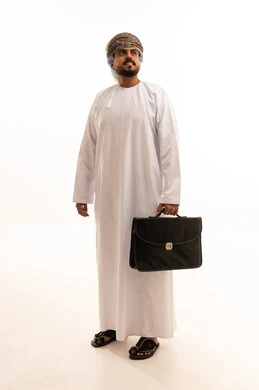 Omani Businessman in Dishdasha Holding Briefcase