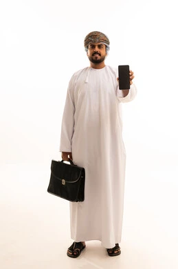 Omani Businessman Holding Smartphone and Briefcase