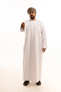 Omani Man in Traditional Dress Making Hand Gesture