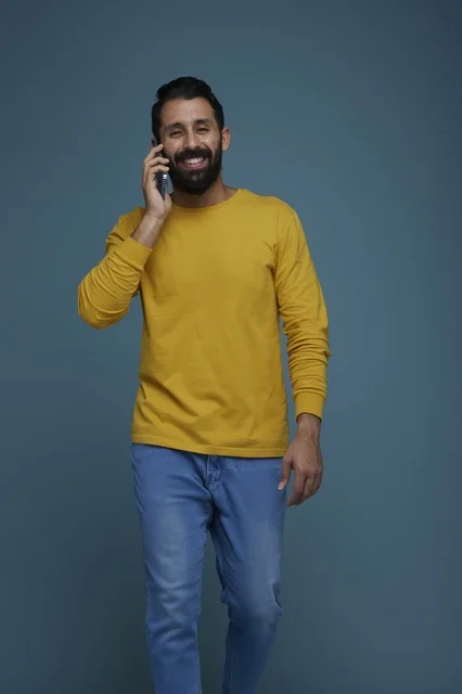 Saudi Man Talking on Smartphone in Casual Clothes