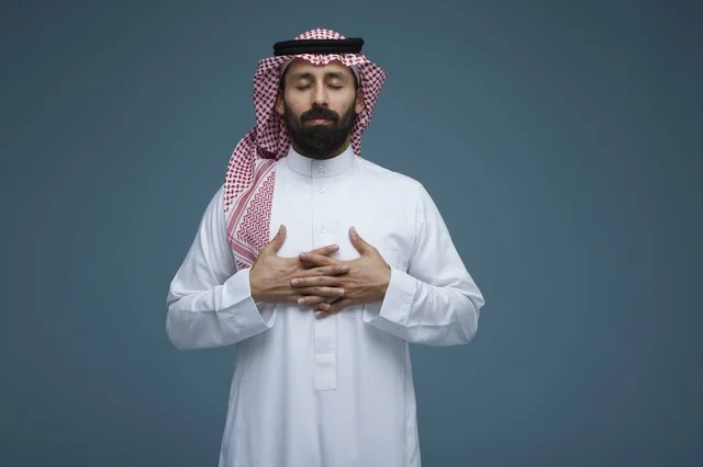 Saudi Man in Traditional Thobe on Blue Background