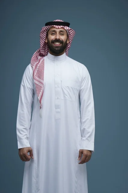 Smiling Saudi Man in Traditional Thobe and Shemagh