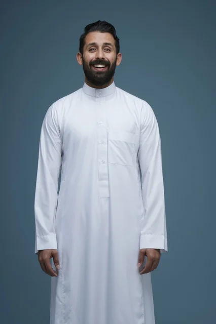 Smiling Saudi Man in Traditional White Thobe Studio Portrait
