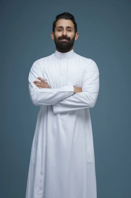 Saudi Man in White Thobe with Crossed Arms