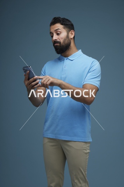 Middle Eastern Man Using Smartphone in Casual Attire