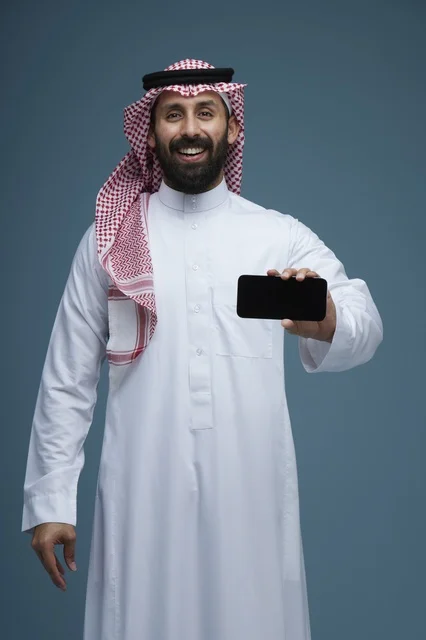 Saudi Man Holding a Smartphone on Blue Background