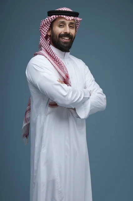 Saudi Man Wearing Traditional Thobe Smiling in Studio