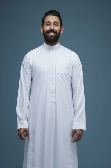 Smiling Saudi Man in White Thobe Studio Portrait
