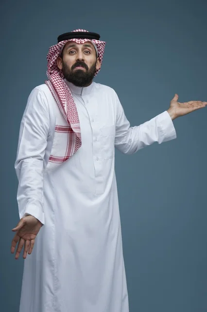 Saudi Man in Traditional Dress Shrugging on Blue Background