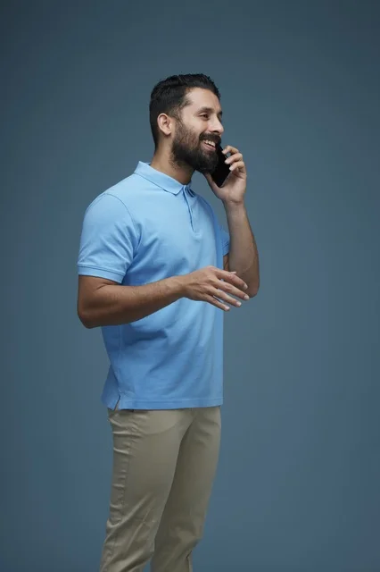 Saudi Man Talking on Smartphone in Casual Wear