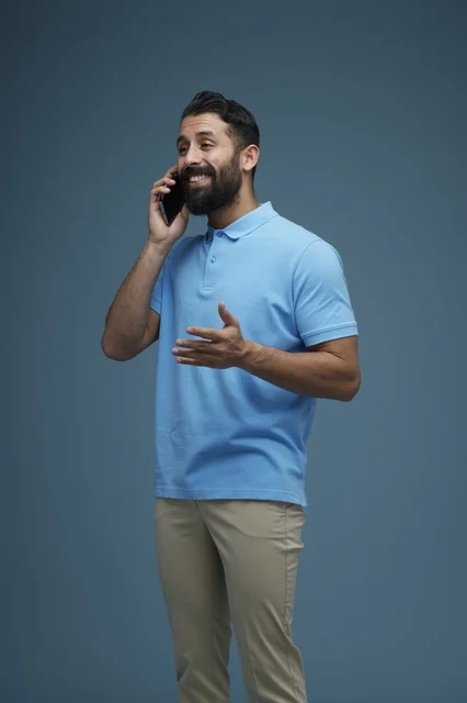 Saudi Man Talking on Smartphone in Casual Wear