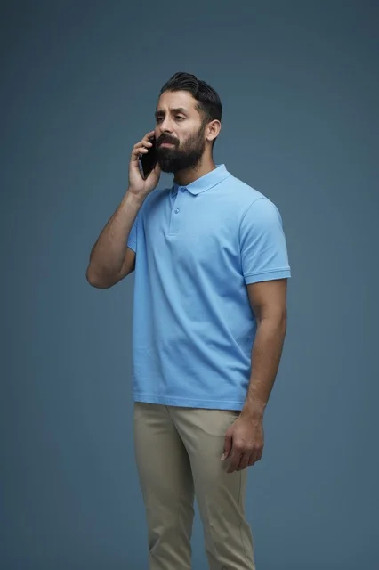 Saudi Man in Casual Wear Talking on a Smartphone
