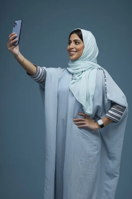 Saudi Woman Taking Selfie with Smartphone