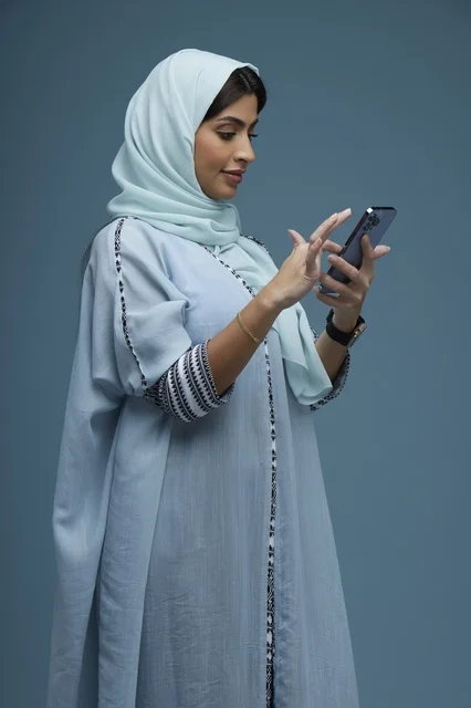 Saudi Woman Using Smartphone Side View Profile