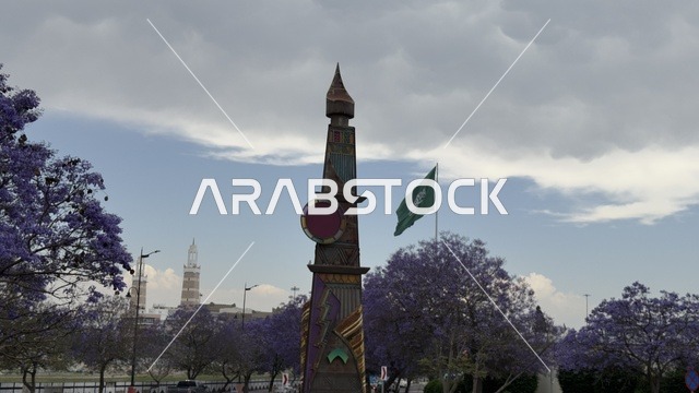 Jacaranda Trees and Saudi Flag in Abha City Park