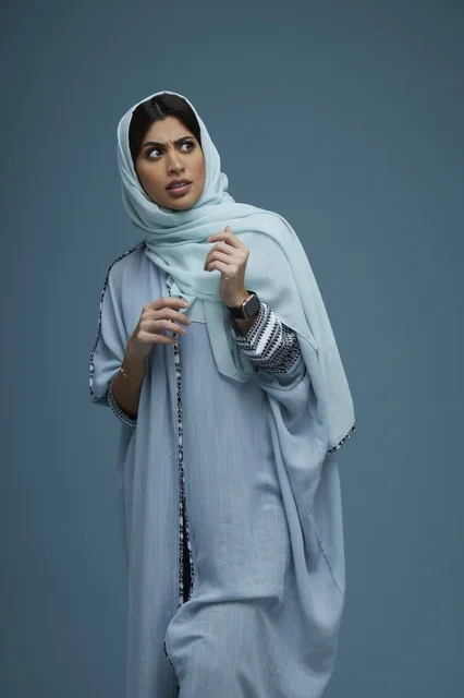 Confused Saudi Woman in Blue Abaya Studio Portrait