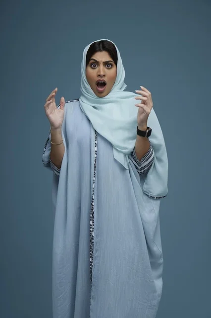 Shocked Saudi Woman in Blue Abaya Studio Portrait