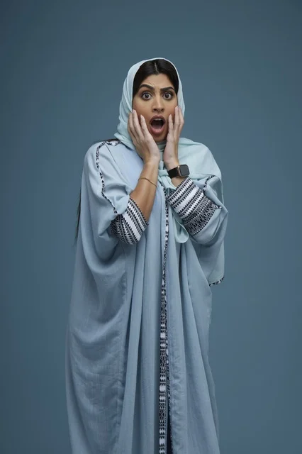 Shocked Saudi Woman in Blue Abaya Studio Portrait
