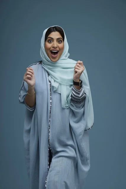 Excited Saudi Woman Reacting with Surprise in Abaya